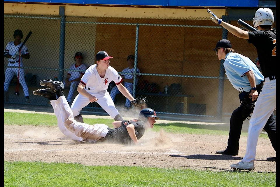 Trail U18 Orioles Raiden Dobie attempts to steal home in an exciting 7-6 victory over the North Fraser Nationals on Sunday at Butler Park. Photos: Jim Bailey