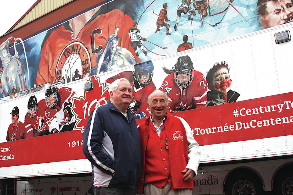Cal Hockley, ‘61 Trail Smoke Eaters captain, and Norm Lenardon stopped for a photo in front of the mural dedicated to the ‘61 Smoke Eaters and Minor Hockey Day in Canada in February, 2014. Hockley passed away in December 2020. Photo: Jim Bailey