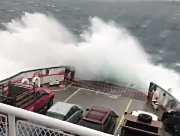 A giant wave covered the vehicle deck of the Quadra Island-Campbell River ferry during a stormy crossing on Wednesday. Screengrab from video recorded by ferry passenger Bubba Muldoe