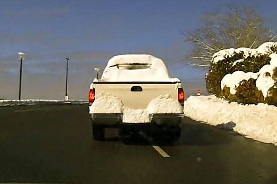15571229_web1_190214-NBU-Vehicle-pulled-over-for-too-much-snow-on-it-Nanaimo