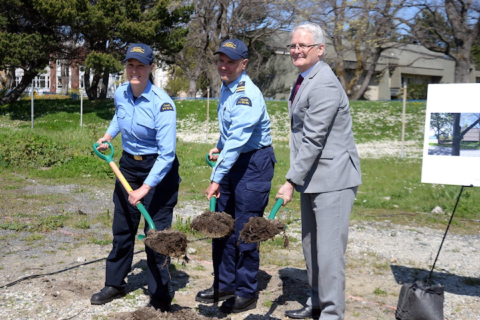 Member of the Canadian Coast Guard’s rescue team join Transport Minister Marc Garneau in breaking ground on a new search and rescue station at the base on Dallas Road. (Nina Grossman/News Staff)