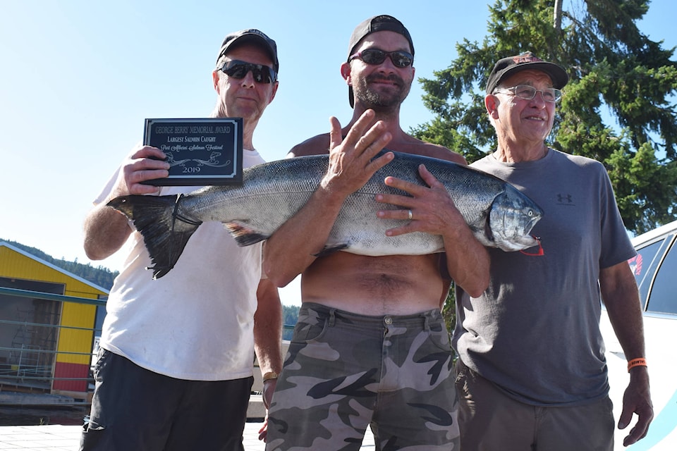 Jim Boorman of Qualicum Beach, left, caught the $15,000 winning fish at Salmon Festival with friends Trent and Harlen Morse. ELENA RARDON PHOTO
