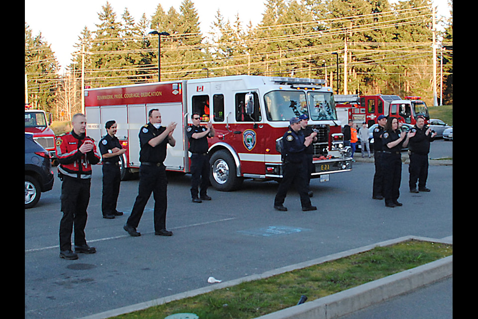 First responders applaud the health care workers at Oceanside Health Care Centre. (Michael Briones photo)