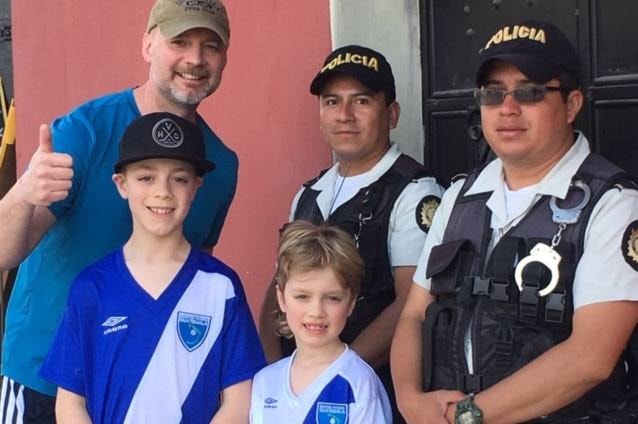 Oak Bay Police Deputy Chief Ray Bernoties and sons Trevor and Dexter meet a pair of Guatemalan police officers during their March vacation. (Carol Bernoties Photo)
