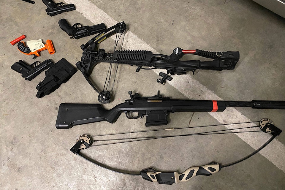 Replica guns along with a real crossbow and compound bow were also seized. (Photo courtesy VicPD)