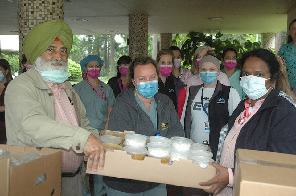 21692434_web1_200528-CCI-Sikh-temple-meals-for-workers-meals_1