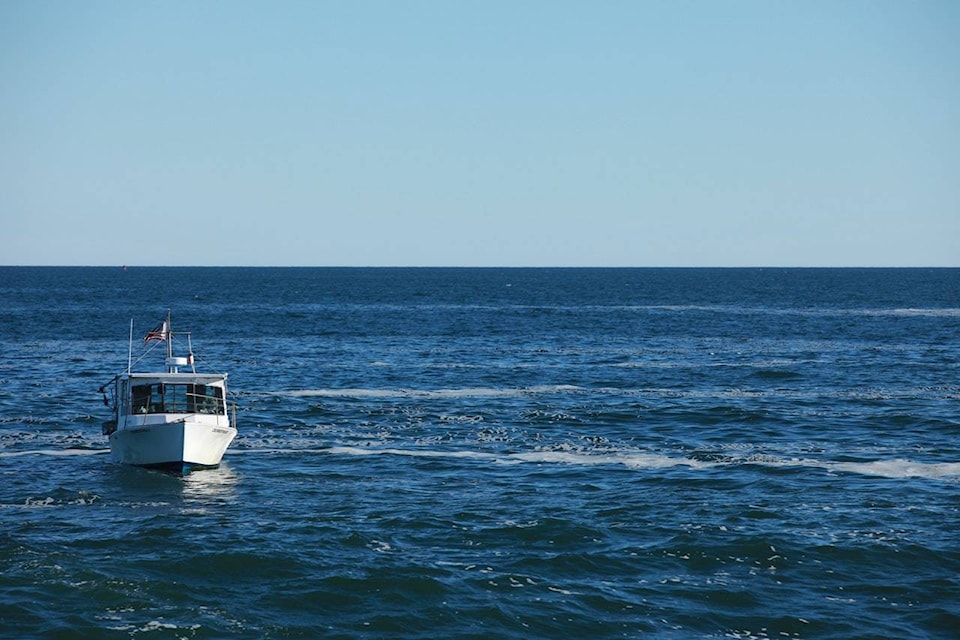 22197188_web1_white-boat-in-beach-during-day-time-499679