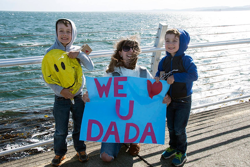 Trista Sutton and sons Hudson, 5, (left) and Oliver, 4, (right) braved the blustery Ogden Point to wave goodbye to husband, dad and Canadian Armed Forced member Kris Sutton, who will be deployed for more than four months. (Nina Grossman/News Staff)