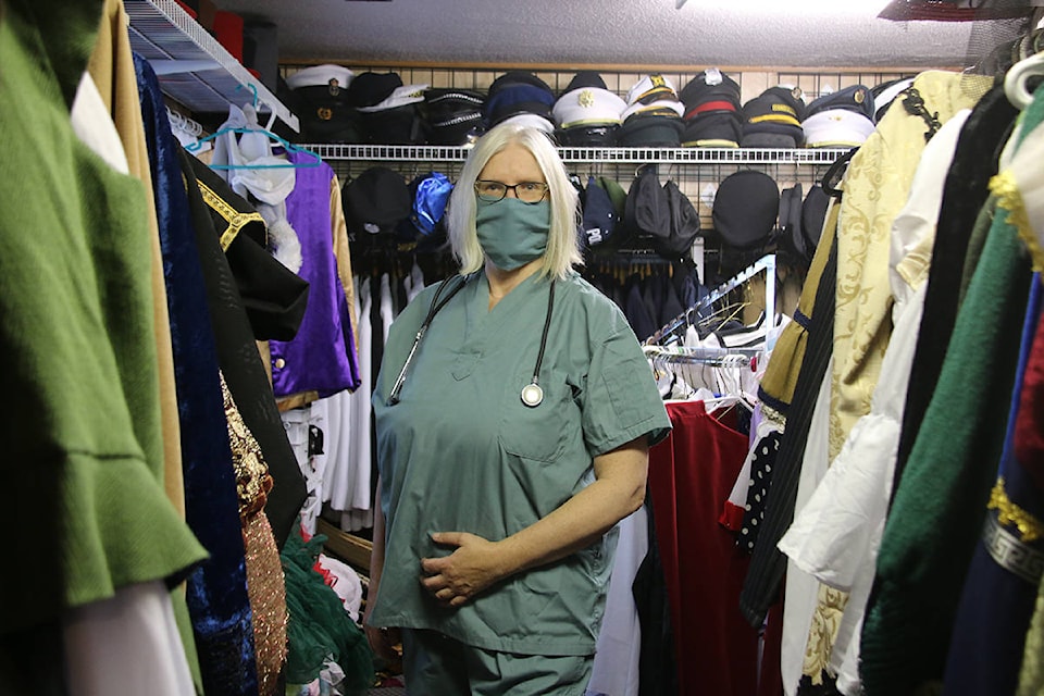 Maureen Cue, owner of Disguise the Limit costume shop, models – maybe the most obvious – pandemic costume. (Kendra Crighton/News Staff)