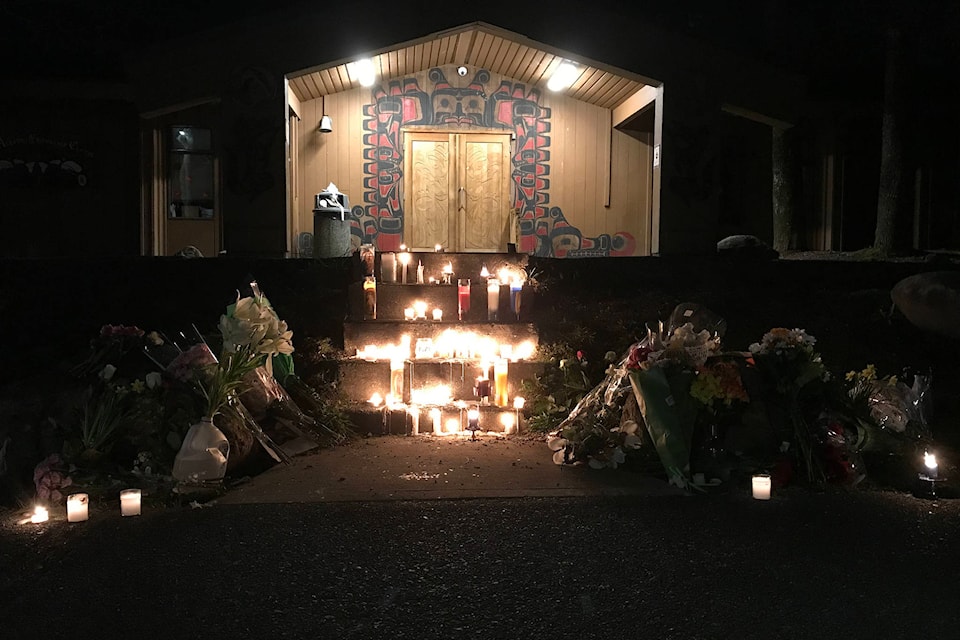 Candles burn on the front steps of the Port Alberni Friendship Center in memory of Clifton Johnston, who died tragically nearby on March 27, 2021. (SUSAN QUINN/Alberni Valley News)