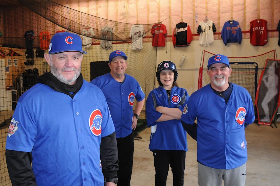 Kelly McGiffin, left, Dwayne Stern, batboy Jackson McGiffin and Kirk McGiffin are reviving the Port Alberni Cubs—this time as an over-55 baseball team. (SUSAN QUINN/ Alberni Valley News)