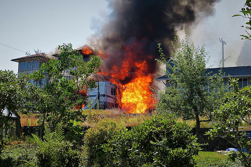 Fire engulfs house on Barclay Road on June 29. Photo by Jim Toso