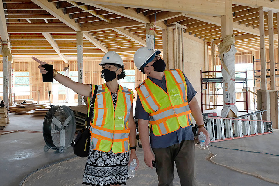 Mayor Maja Tait and Coun. Jeff Bateman checking out features of Sooke’s new library, currently under construction. (Zoe Ducklow/News Staff)