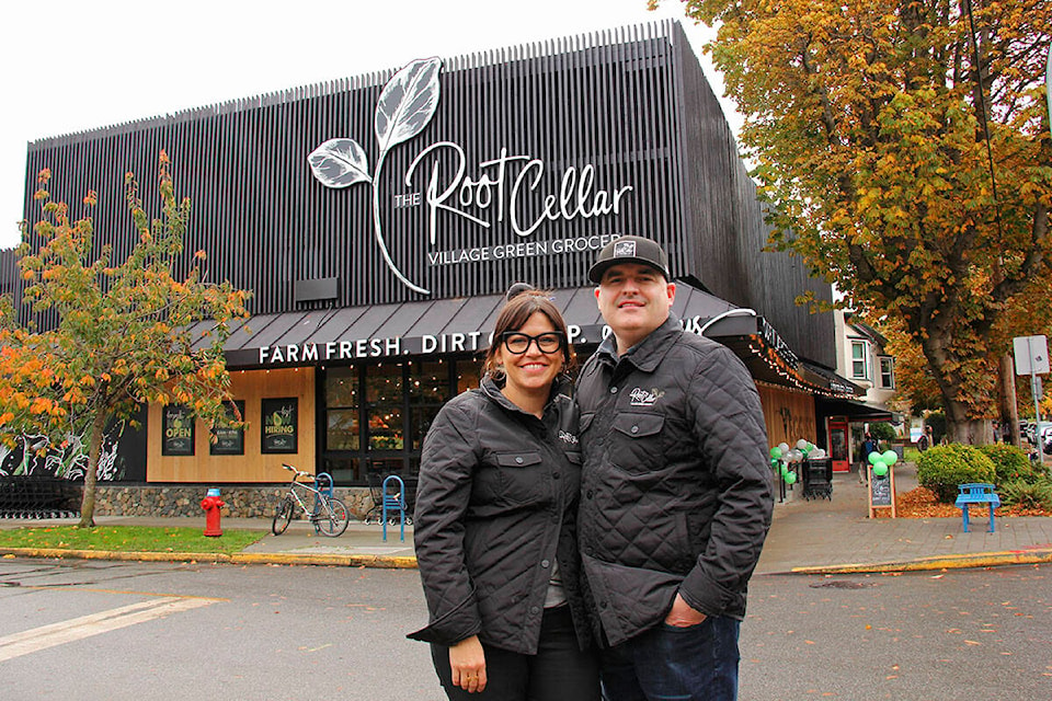 Root Cellar owners Daisy and Adam Orser stand in front of their new Cook Street location on its opening day Oct. 20. (Jane Skrypnek/News Staff)