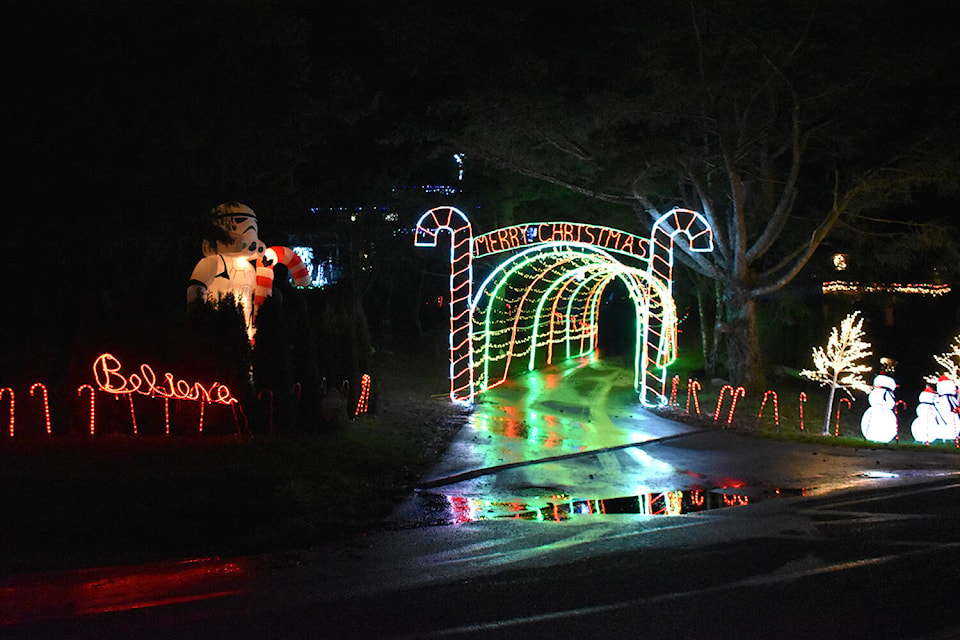 A tunnel of candy canes welcome visitors to this home on Moxon Terrace in North Saanich. (Wolf Depner/News Staff)