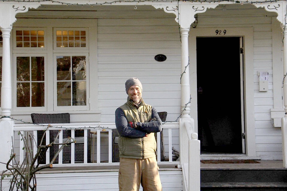 New owners Rumon Carter (pictured) and partner Jennie Sprigings plan to add to the memories and stories crafted in this historic home on Island Road in Oak Bay. (Christine van Reeuwyk/News Staff)