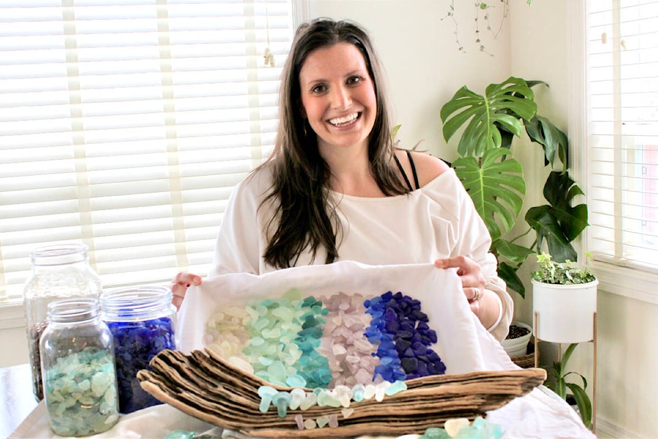 Lora de Vries with some of her collection of sea glass. “I got hooked on the thrill of finding these little pieces of history,” she says. (Contributed - Lora de Vries)