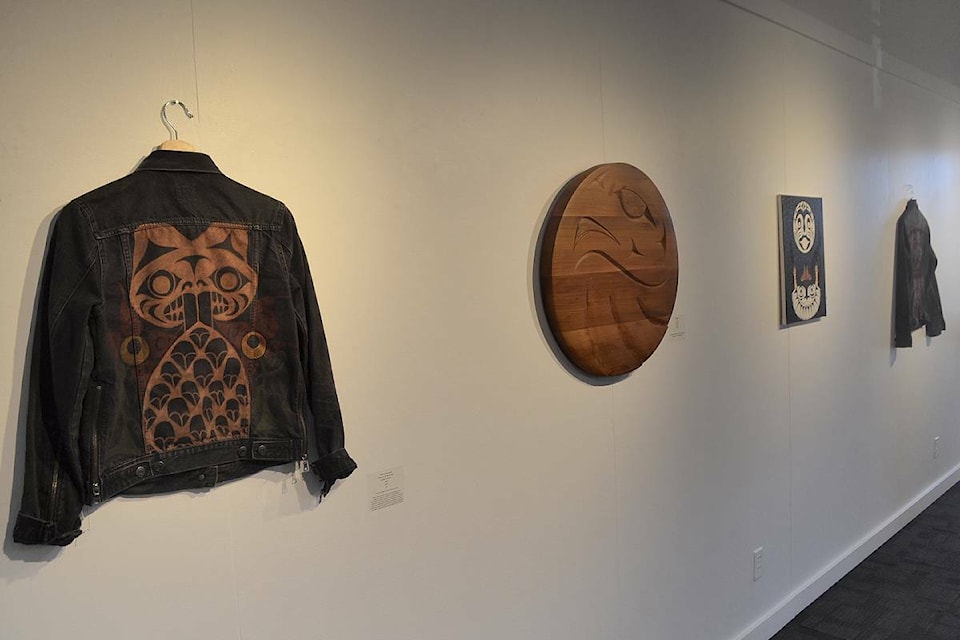 From left: ‘Beaver in the River Lilies’, acrylic on denim by Mathew Andretta.; ‘Eagle’, red cedar by Jesse Recalma; ‘Moon Gifts a Blanket’, acrylic on canvas by Andretta; and ‘Copper Shield’, acrylic on denim by Andretta. (Mandy Moraes photo)