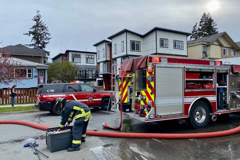 West Shore fire crews responded to a townhome fire in Langford Saturday evening, which left a family pet dead. (Justin Samanski-Langille/News Staff)