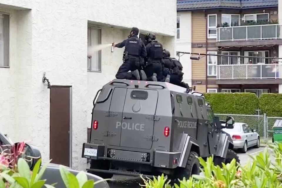 Tense standoff Police spray what appeared to be tear gas into a Quadra Street apartment where a man had barricaded himself Tuesday evening. See story on Page A4.(Justin Samanski-Langille/News Staff)