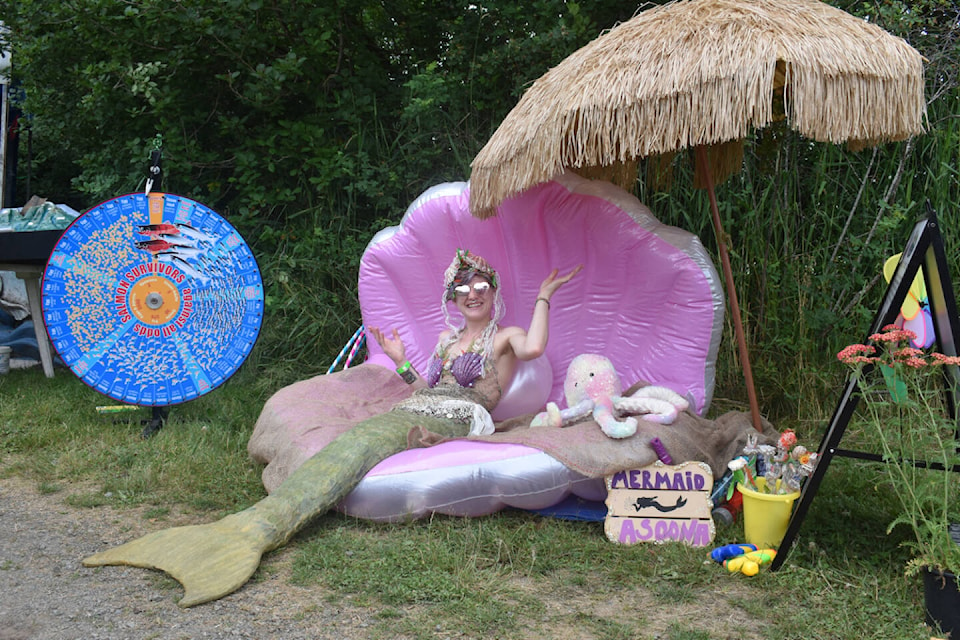 You never know what you’ll see at Vancouver Island MusicFest. A mermaid poses for a picture. Photo by Terry Farrell