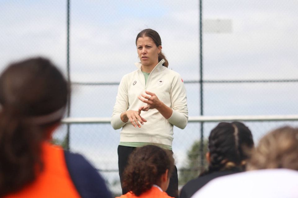 Olympic soccer gold- and bronze-medallist Stephanie Labbé addresses a group of young players during a camp at the Sherman Road turf last Sunday. (Kevin Rothbauer/Citizen)