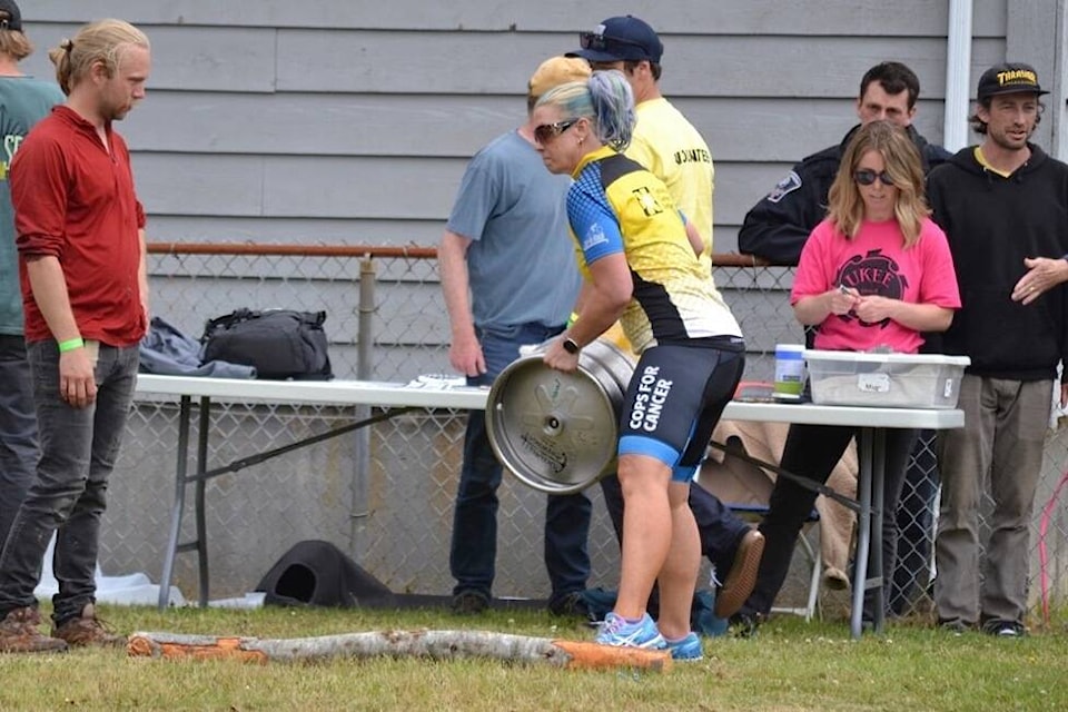 Rachelle Cole hurls a keg during the 2022 Ukee Days Keg Toss competition. (Nora O’Malley photo)