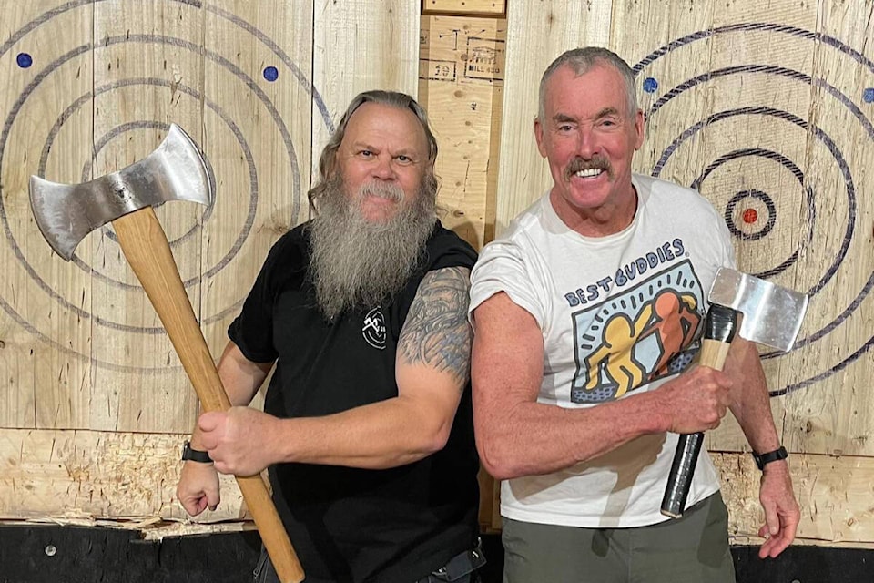 Axe and Grind coach Ragnar Olafson poses for a photo with TV star John C. McGinley. (Axe and Grind/Facebook)