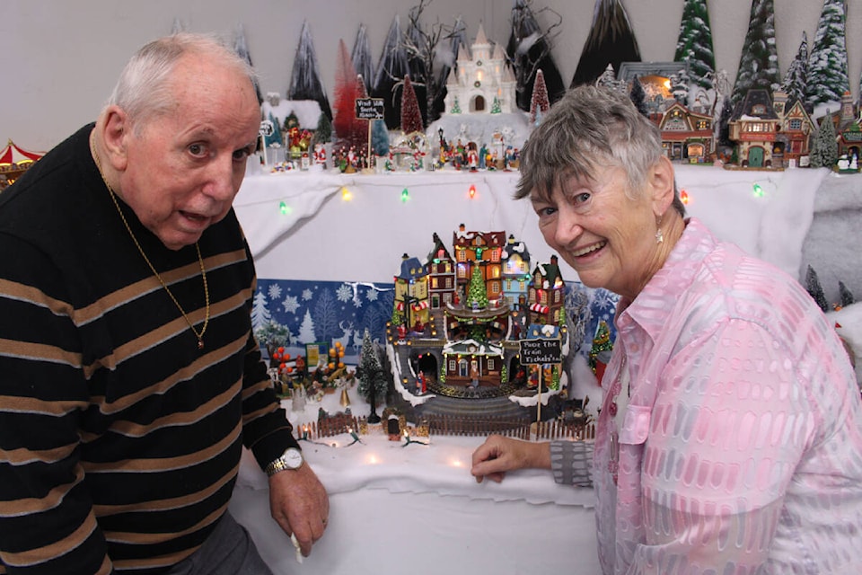Dennis and Donna Jones show off part of their Christmas Village display at Cassy’s Coffee House in Youbou. (Andrea Rondeau/Gazette)