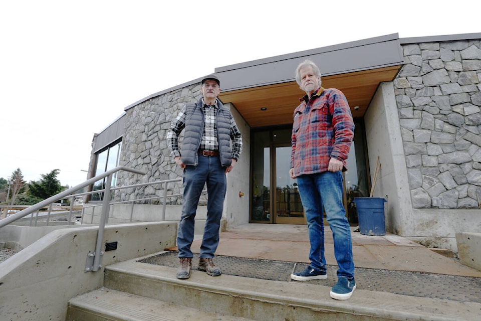 Ian Booth, president of the Victoria Scottish Community Centre Society and Jim Maxwell, president of the Victoria Highland Games Association, stand in front of the nearly finished Craigflower Community and Performing Arts Centre in View Royal Friday (Jan. 13). (Justin Samanski-Langille/News Staff)