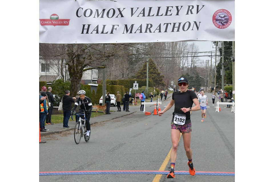 Kylie Acford crosses the finish line at the Comox Valley RV Half Marathon with a time of 1:20:21 to win the women’s division. Photo by JoeCrazyLegs