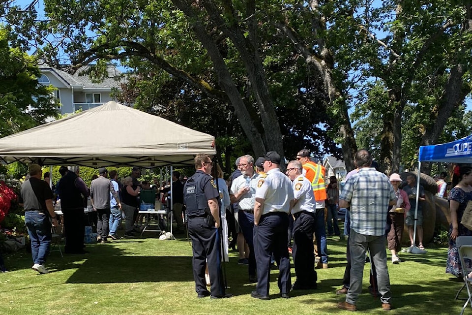 Community members from across the Capital Region show support for the family of Steve Seekins – the Oak Bay public works employee killed on the job May 17 – during a fundraising barbecue on the lawn of municipal hall May 25. (Gui Santos/Black Press)