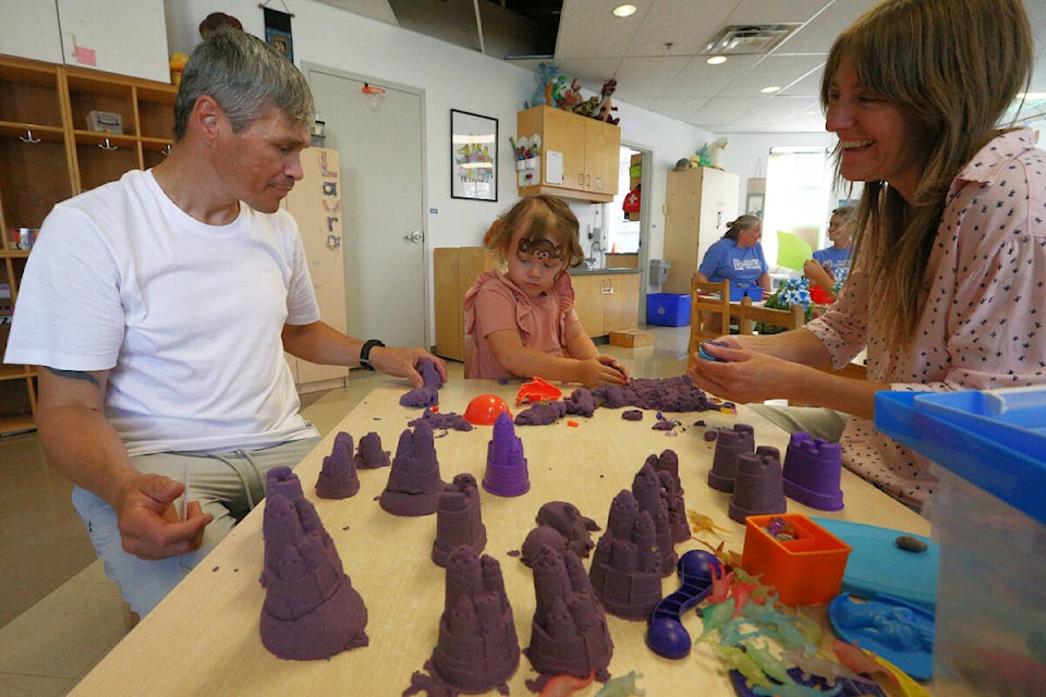 Kye Soluk, Pippa Zahn, and Ginger Zahn play with mouldable sand during the Cridge Centre for the Family’s 150th anniversary celebrations Saturday (Sept. 16). (Justin Samanski-Langille/News Staff)