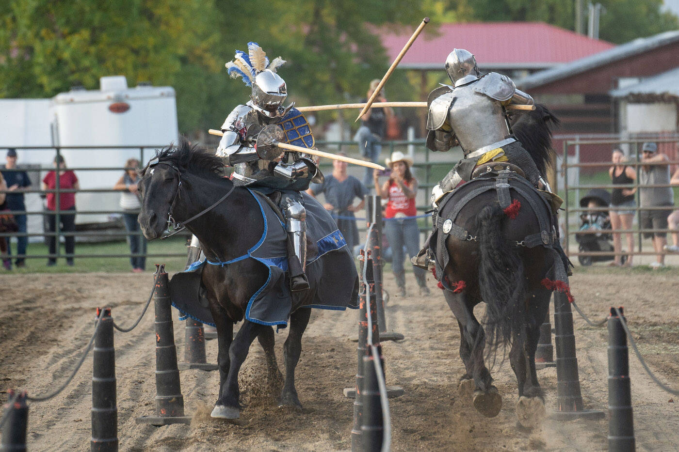 Josh Tobey (left), whos a member of jousting troupe Knights of Valour, competes in a match at the Salmon Arm Fair on Sept. 8, 2023. (Lindsay Adam)