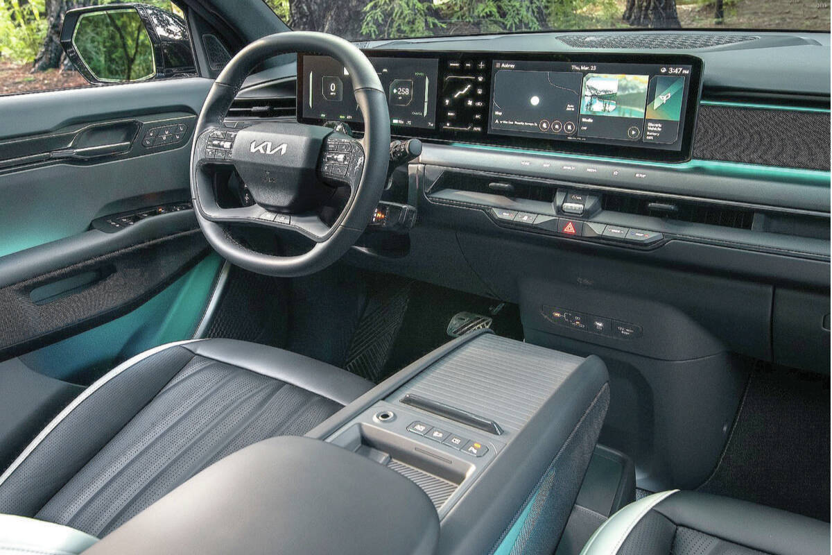 The dashboards engaging 12.3-inch screens one for the digital gauges and one for the infotainment display appear as a single panel. Note how few buttons are located on the dashboard below the screens. PHOTO: KIA