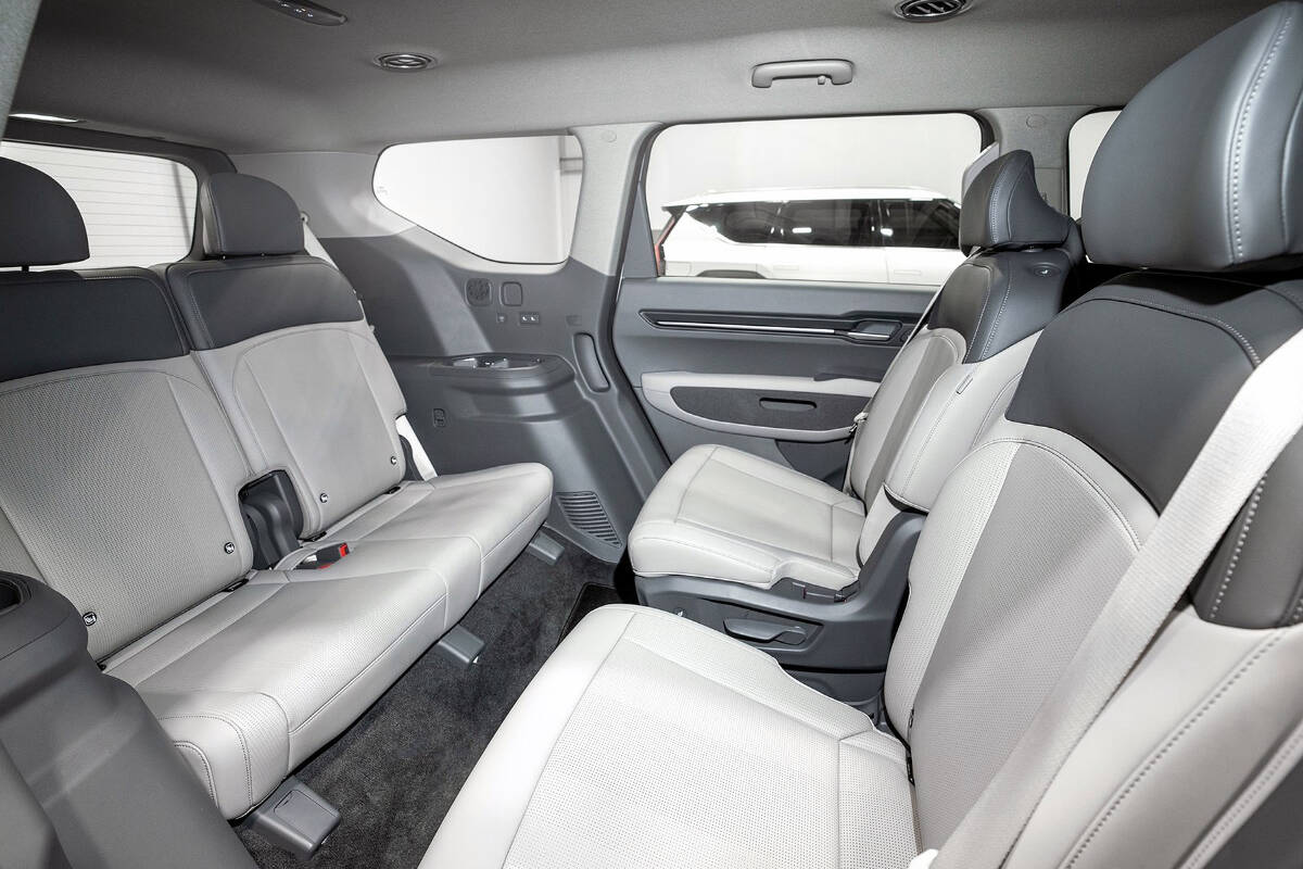 The seat fabrics for all three rows are made from partially recycled materials and are completely synthetic (no animals are used). The optional second-row high-back bucket seats can swivel to face the third row, or toward the open side doors. PHOTO: KIA