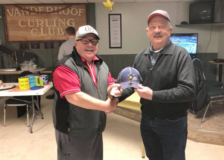 John Murphy presenting a special trophy hat to Keith Wruth, winner of Best All Round curler, a well deserving long time supporter of the men’s curling in Vanderhoof. Photo Michelle Naka