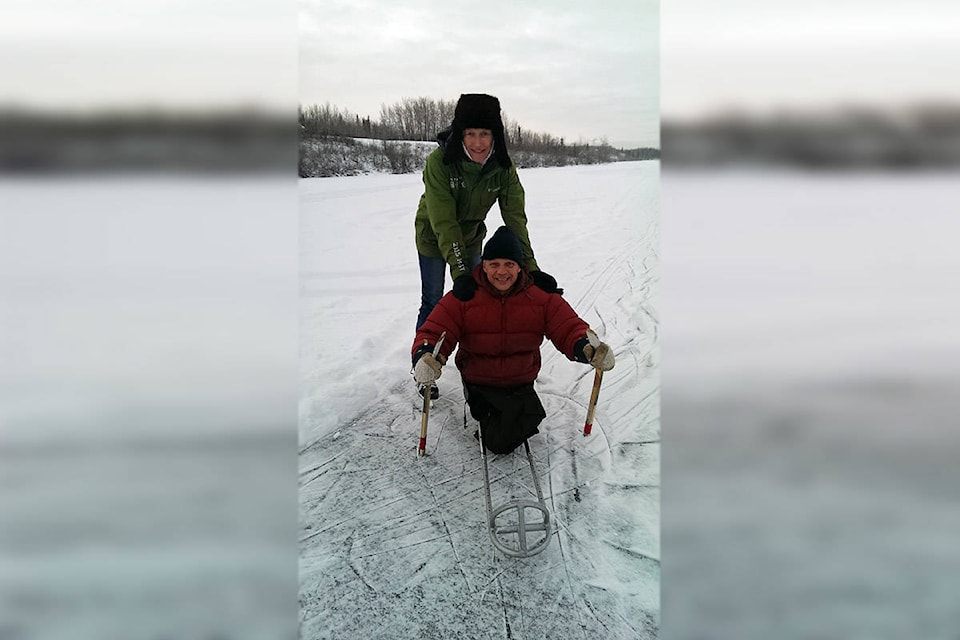 Kelvin Mickelson with his wife Melissa enjoy a cold winter day on Sinkut Lake near Vanderhoof in early January 2016. Mickelson said Para Ice Hockey Qld has currently designed and is trialing a wheeled version of the sled that he hopes will provide schools with a floor version of the sport. (Photo submitted)