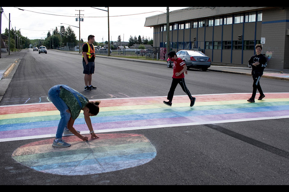 W.L. McLeod Elementary students in Vanderhoof spent their Thursday morning remediating the community’s new rainbow crosswalk that was recently damaged by a large burnout. (Aman Parhar photo)