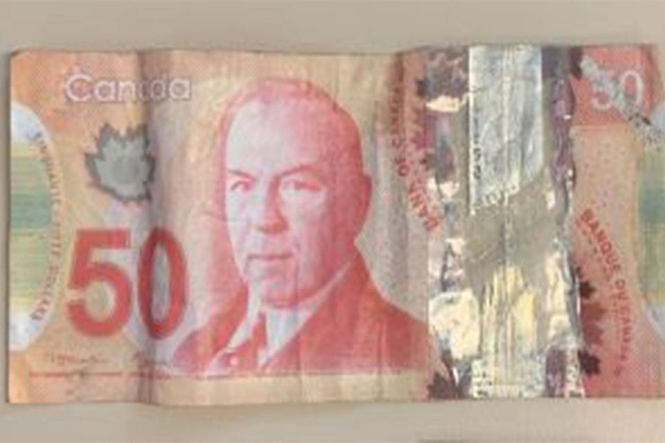 26273537_web1_210902-CCO-CounterfeitBillsCirculating-counterfeit-bills_1