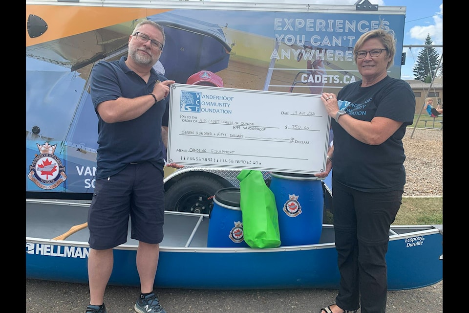 Kathie LaForge from Vanderhoof Community Foundation presents a cheque to David Wlasitz from the Air Cadets 899 Squadron for their project to purchase dry bags for cadets to use while canoeing. (Submitted photo)