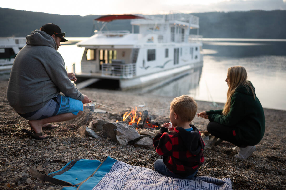 Shuswap Lake houseboating during late spring and early fall offer the additional benefit of beachfront campfires! Twin Anchors Houseboats photo
