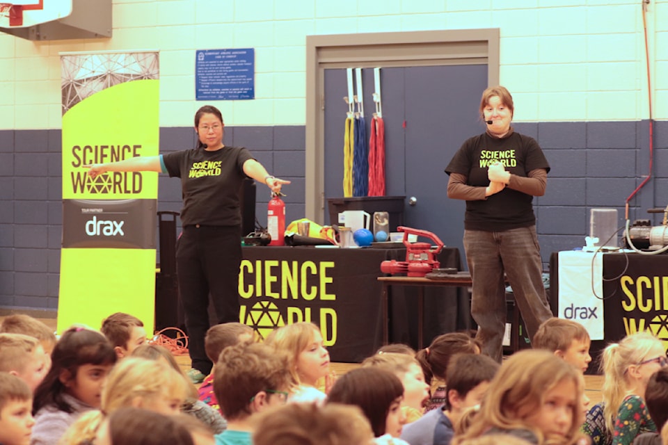 Karen Jang (left) and Mariela Shuley take kids at Vernon's Silver Star Elementary on a scientific adventure as part of Science World's travelling On The Road team Wednesday, Dec. 4, 2024. 