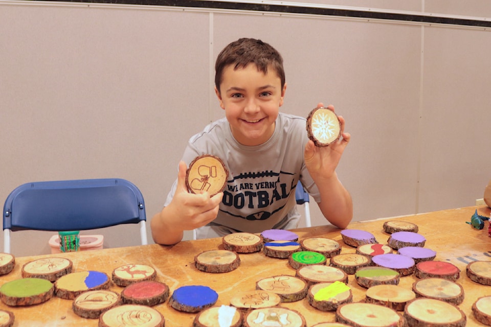 Grade 6 student Dawson was selling wooden coasters he made for BX Elementary's Young Entrepreneur Fair Friday, Dec. 13, 2024. 