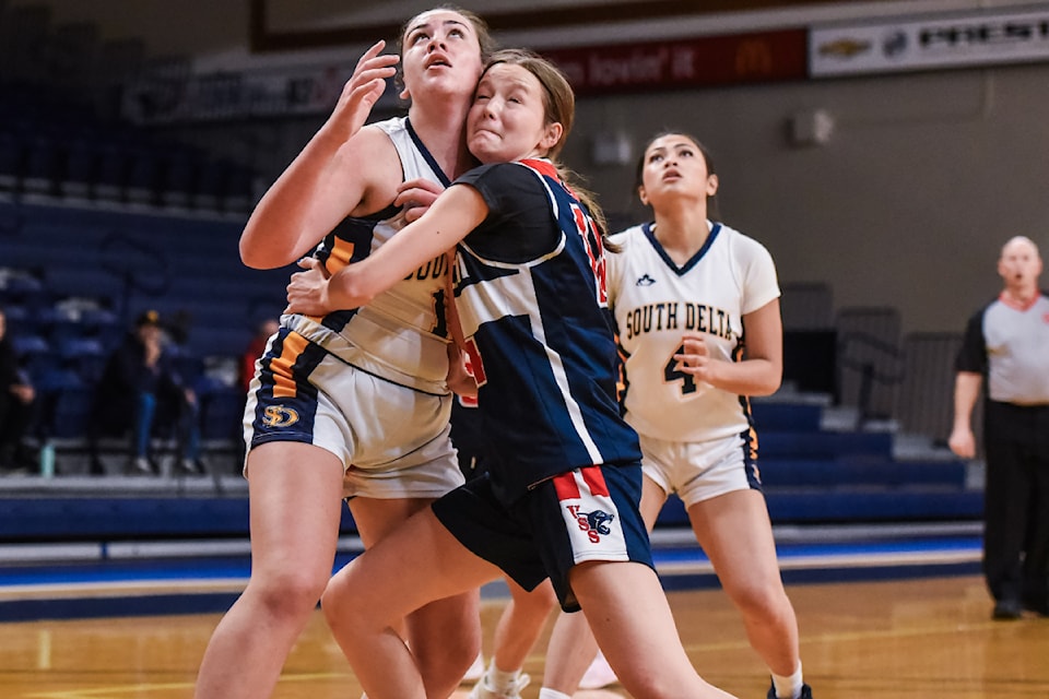 Vernon Panthers forward Adie Janke (dark jersey) battles for rebound position with South Delta's Zoe Millette (left) and Jalen De Dios at the Tsumura Basketball Invitational senior girls basketball tournament in Langley Thursday, Dec. 12. Janke and the Cats defeated the Sun Devils 63-54 to advance to the semifinals.
