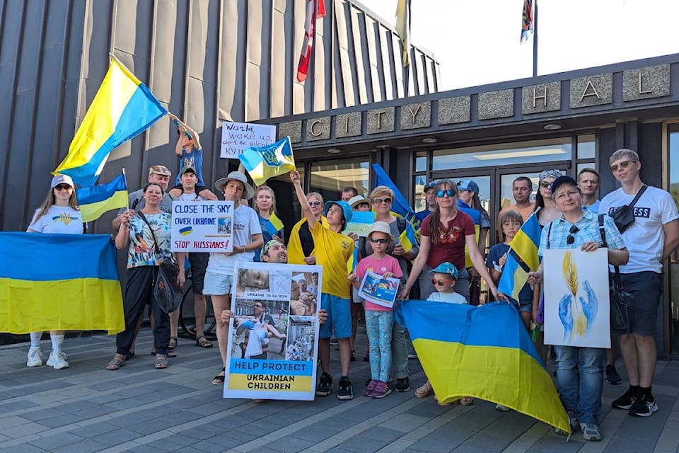 A contingent of Ukrainian supporters waved signs and flags on Monday night, to raise awareness on the continuing atrocities committed by Russians.