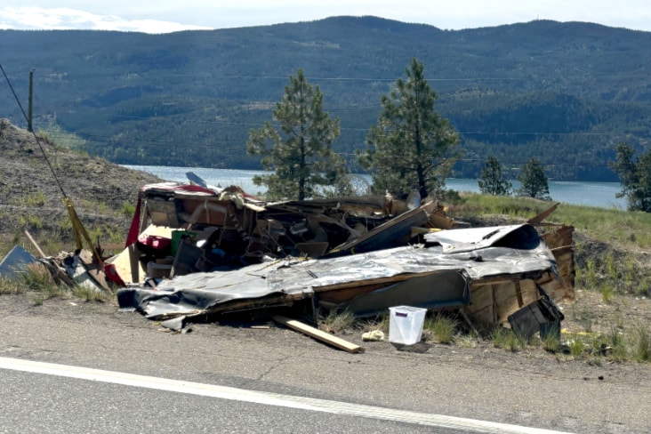 A truck and trailer rolled off Highway 97 near Vernon June 11.