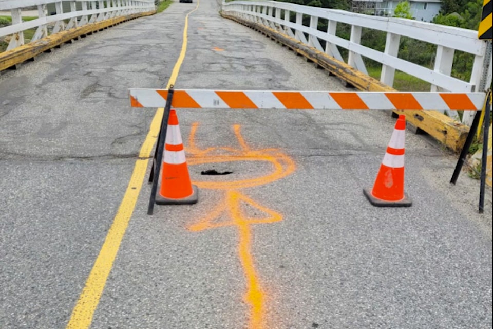 A small sinkhole has appeared in front of a bridge on Grandview Flats Road in Spallumcheen Saturday, June 22, 2024. The bridge has been closed out of an abundance of caution.