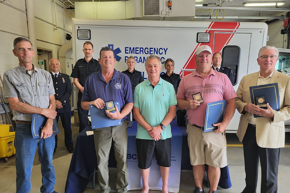 David Hampton (front, centre) had a chance to meet with seven of eight people Monday, June 24, in Vernon, who saved his life a second time in January 2023. Rescuers Jeff Moore (front, from left), Scott Ross, Mitch Nystrom, and Bob Outhwaite used CPR and an Automated External Defibrilator during a hockey game after Hampton went into cardiac arrest. Paramedics Zach Clarkson (back, second from left), Lauren Cave (third from left), and Brittni Sagert (second from right) took over that night from the hockey players. Representing B.C. Ermergency Health Services, Dan Zawyrucha (back, left, area manager) and Scott Lequesne (back, right, paramedic chief) were on hand to present the hockey players with a Vital Link Award (missing from photo is award-winner Ron Burton). 