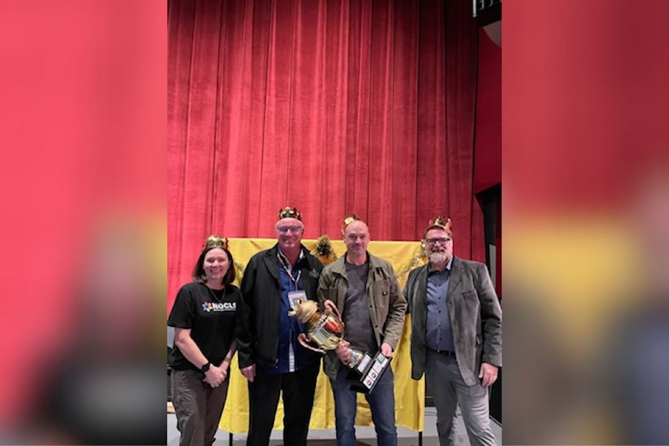 Chef Christen of Cambium Cider Co. (second from right) is presented the Gold Trophy from sponsor Paul Martin of Lake City Casino (second from left), and Ruth Callendar (left) and Darren Bradley of North Okanagan Community Life Society for winning the 2024 NOCLS Golden Burger Challenge. 